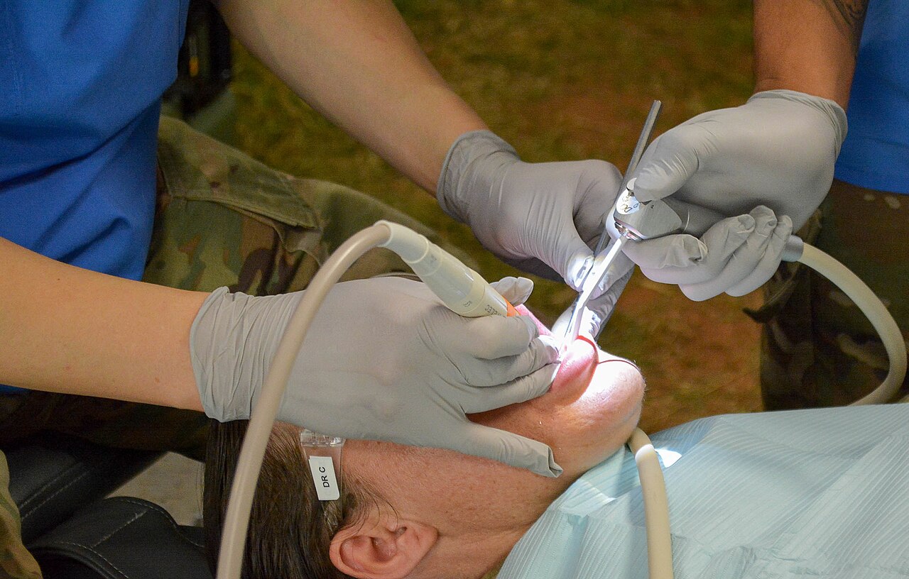 Soldiers from Dental Health Command Europe conduct a dental exam Sept. 4 on a Soldier from the 16th Sustainment Brigade during “Operation Tombstone." "Operation Tombstone" was a fi