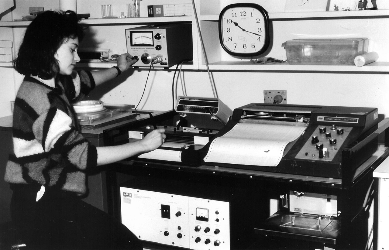 Sally Neville using the LKB microcalorimeter with lever cells. Research program: Regulation of protein and energy metabolism. Photograph on front cover of Sixth Report, CSIRO Divis