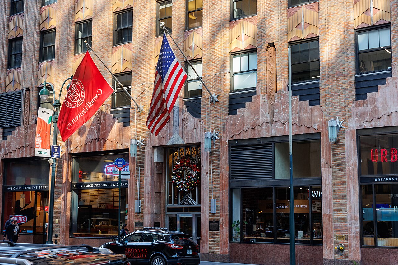 Cornell University flag at 570 Lexington Avenue, NYC. Over a dozen Cornell programs are housed here, including the NYC headquarters for the ILR School and Cornell Cooperative Exten