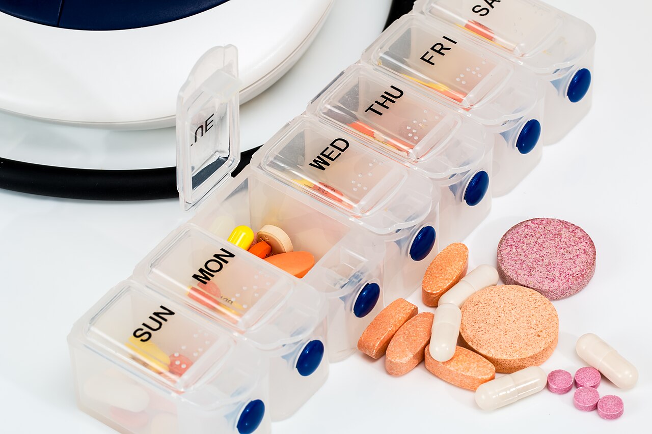 pill organizer that contains medicine and vitamins