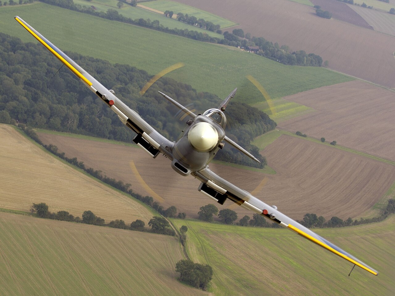 Air-to-air image of a Spitfire from the Royal Air Force (RAF) Battle of Britain Memorial Flight (BBMF), taken over RAF Coningsby in Lincolnshire . Organisation: Royal Air Force (RA