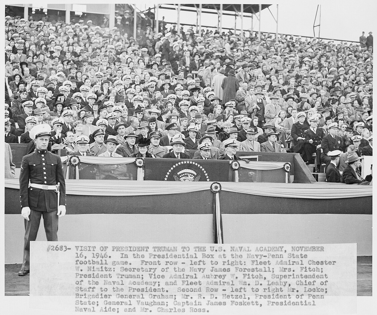 Scope and content: Photograph of the presidential box at the Penn State-Navy football game, during the President's visit to the U.S. Naval Academy: (front row, left to right) Fleet