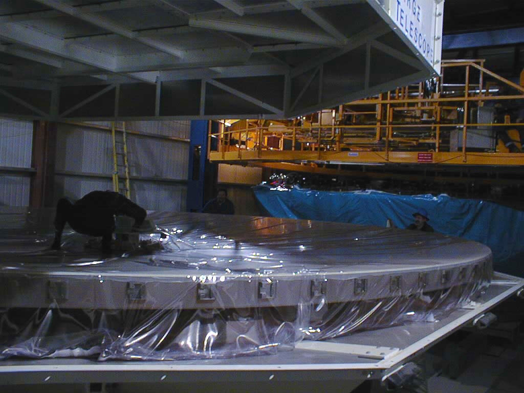 The first photo of the inspection of the VLT 8.2-m Zerodur mirror (M1) after arrival. It shows the mirror in its box on December 18, 1997, now within the Mirror Maintenance Buildin